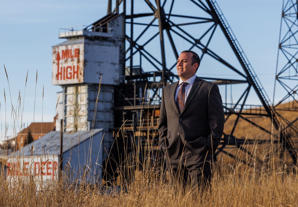 Local Montana workers' compensation attorney with iconic Butte headframe, dedicated to serving families and seeking justice.
