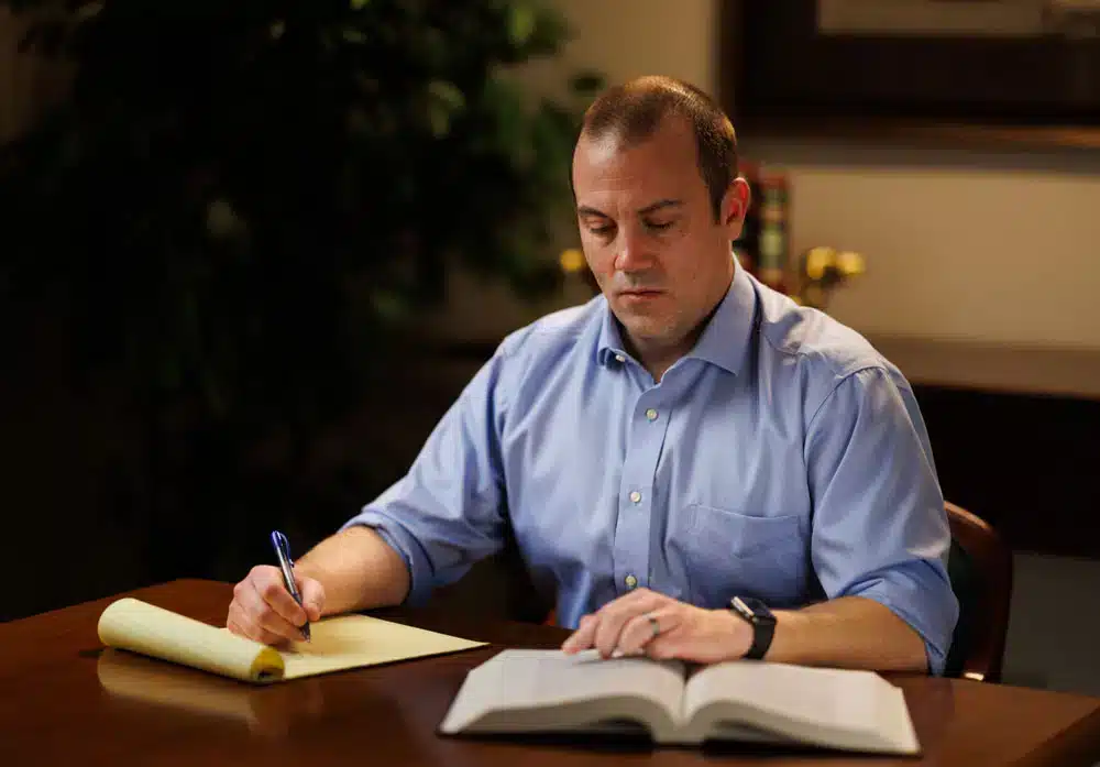 attorney reviewing documents and preparing a trucking accident injury case